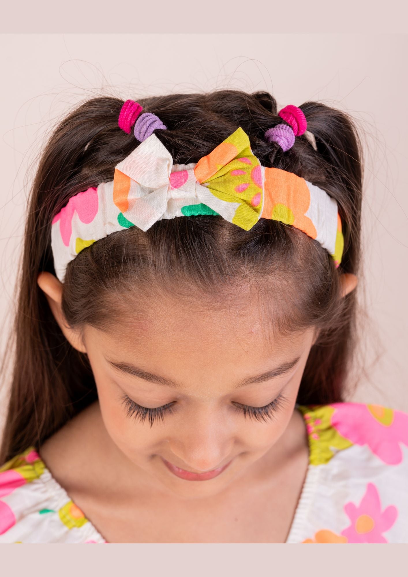 Vibrant Floral print frock with a matching Hairband